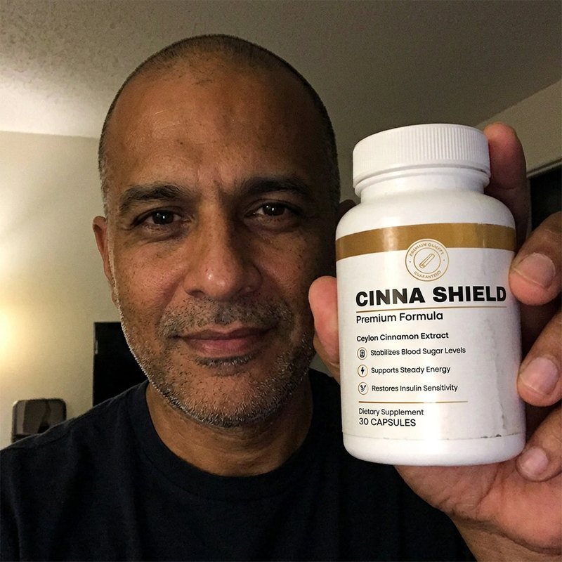 Cinna Shield customer holding their bottle
